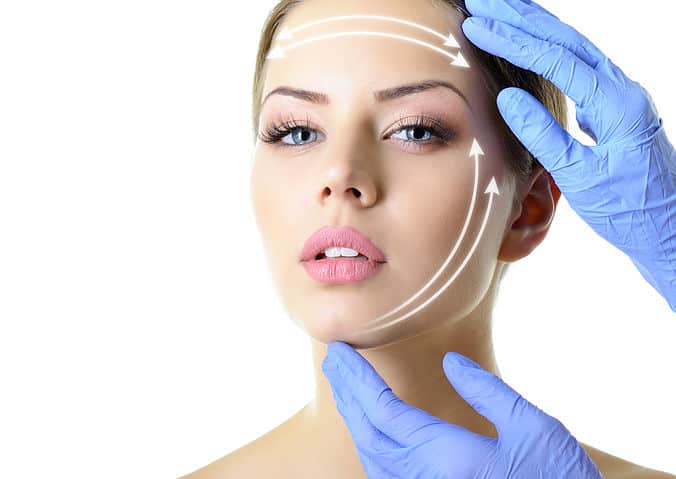 Young woman with healthy skin getting a facelift treatment